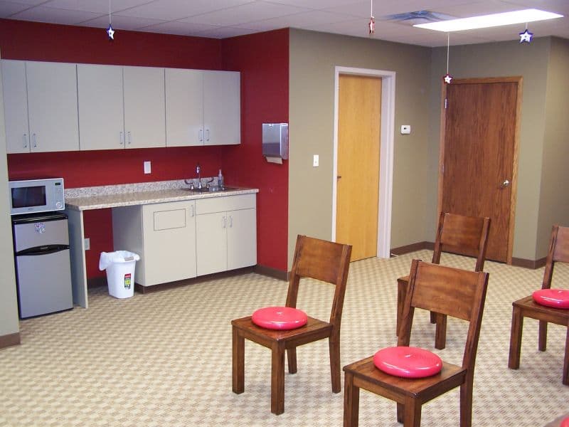 Liberty Chiropractic interior with red accent wall and patriotic star decor